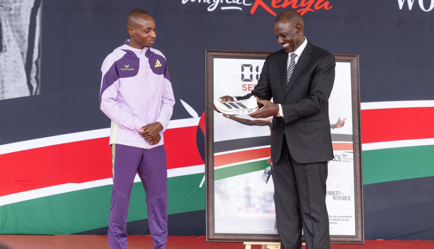 Sabastian Sawe gifts President William Ruto with his record breaking Adidas Adizero Adios Pro Evo 3 super shoe from the London marathon/ HANDOUT