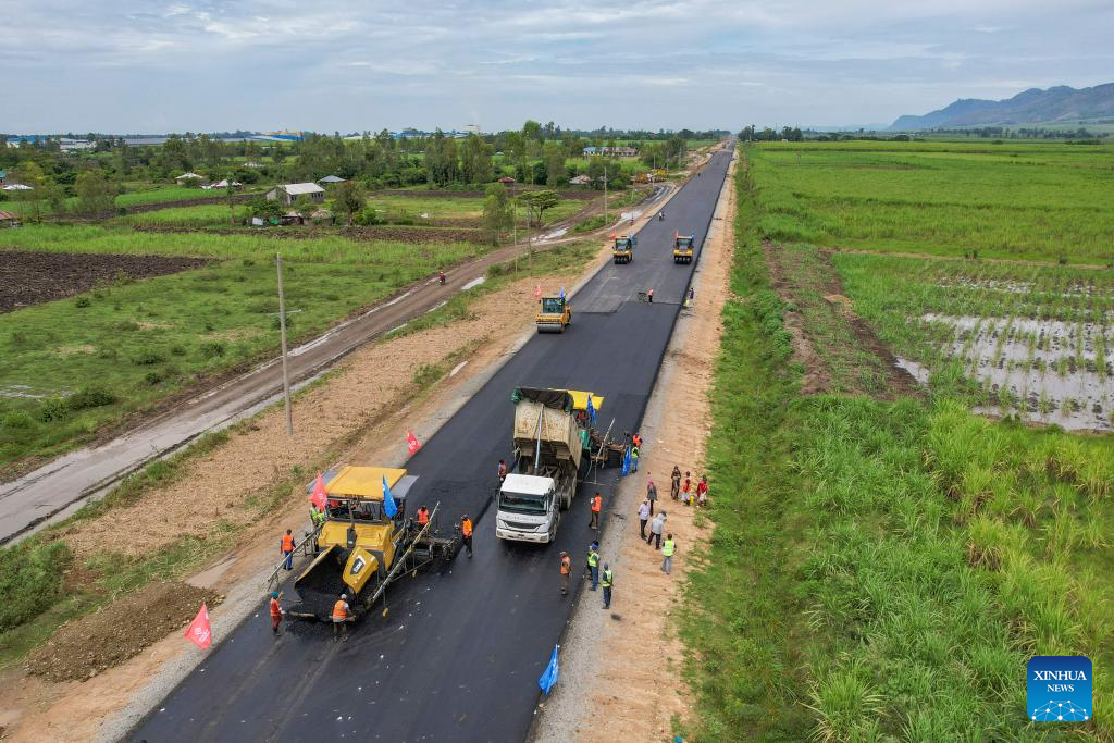 An aerial drone photo taken on Feb. 27, 2026 shows construction vehicles and workers of Power Construction Corporation of China operating at the construction site of the second section of the Kisumu-Muhoroni highway project in a major sugarcane-producing area of Kisumu County, Kenya. Located in Kisumu County, a key economic and transport hub in western Kenya, the area is well known for sugarcane cultivation and sugar production. A road project undertaken by Power Construction Corporation of China (PowerChina) is now bringing visible change to the region. (Xinhua/Xie Jianfei)