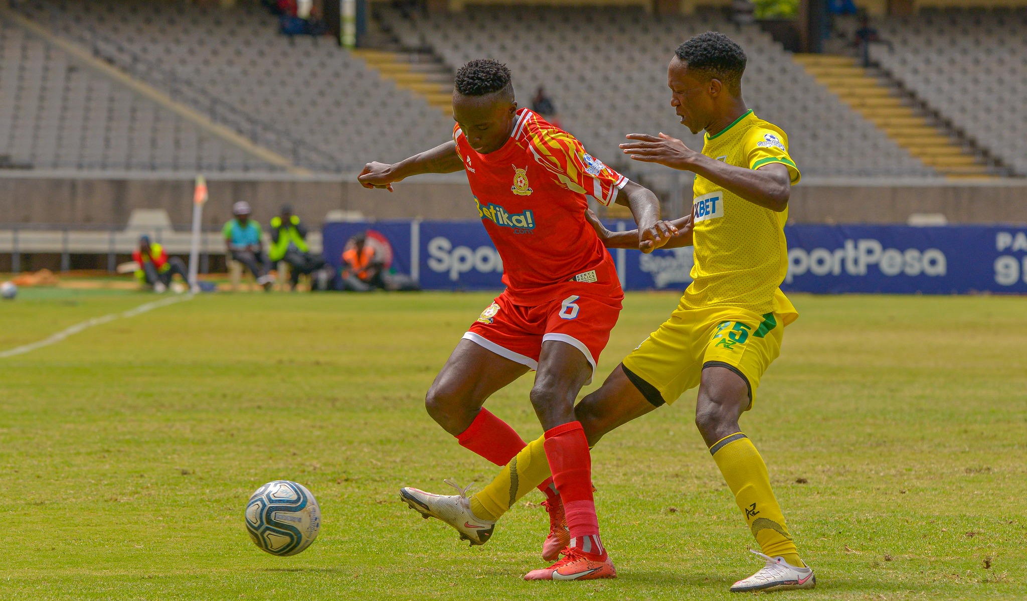 Marvin Nabwire of Police in action with Mathare United's Adams Nyambane