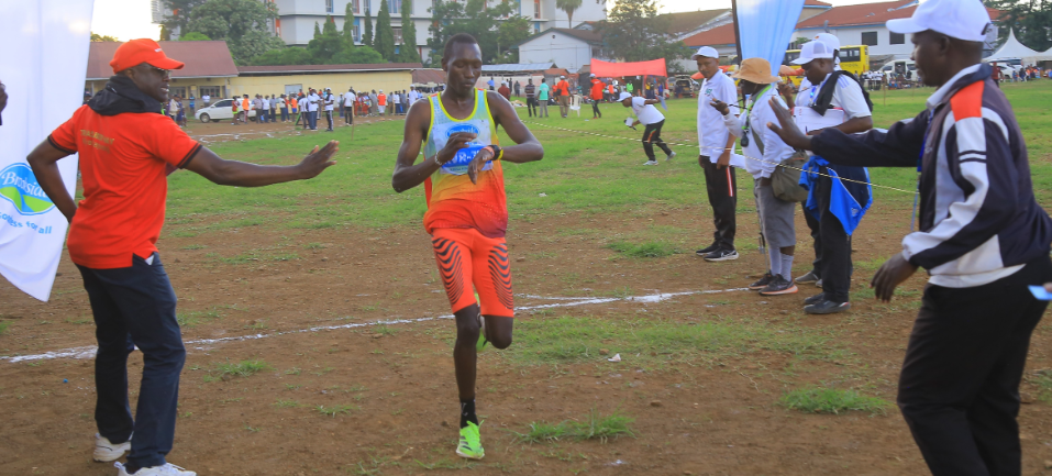 Emmanuel Kiprono crosses the finishing line to win the men's 8km cross country race/ANGWENYI GICHANA