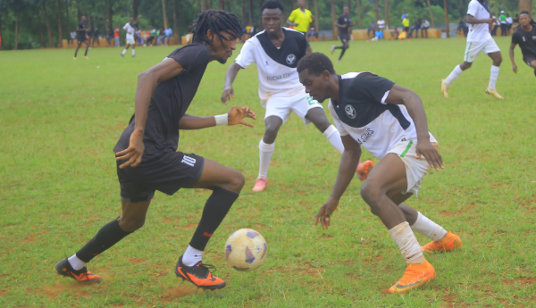 Wayne Mureithi of Equity Bank (L) attempts to dribble past Gucha defenders during their NSL clash on Sunday/ANGWENYI GICHANA