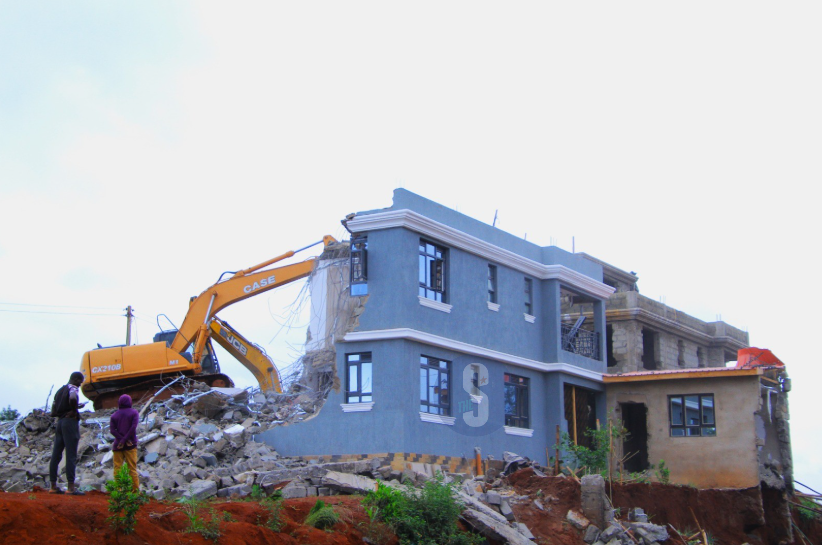 A bulldozer demolishes a palatial home in Marurui on a 300-acre disputed land, May 5, 2026. /EZEKIEL AMING'A
