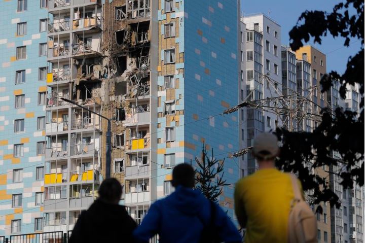 People look at the damaged building after a reported drone attack in Ramenskoe, Moscow region, Russia, on Sep. 10, 2024. (Photo by Alexander Zemlianichenko Jr/Xinhua)