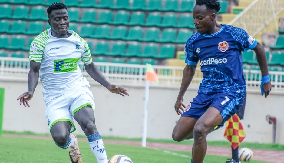 KCB's Boniface Omondi (L) vies for the ball against Murang'a Seal's Price Musebe/HANDOUT