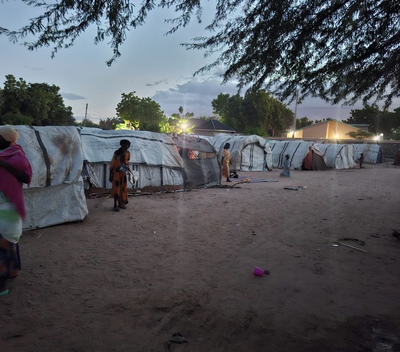 Tents on sandy water grounds camp near the Garissa IEBC offices, with displaced families