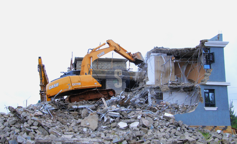 A bulldozer demolishes a palatial home in Marurui on a 300-acre disputed land, May 5, 2026. /EZEKIEL AMING'A