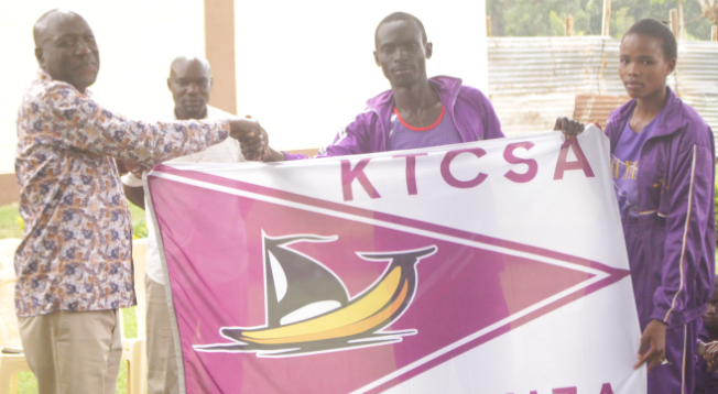 Borabu TTC principal Timothy Oboso hands over the flag to Team Nyanza during last year's championships/ANGWENYI GICHANA