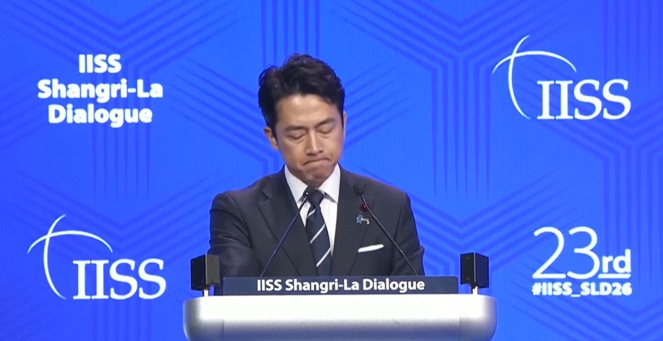 Japan defence minister denies militarism and criticises China's 'huge arsenal'