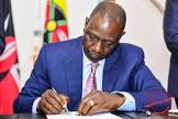 President Williamm Ruto signing a past Finace Bill into law