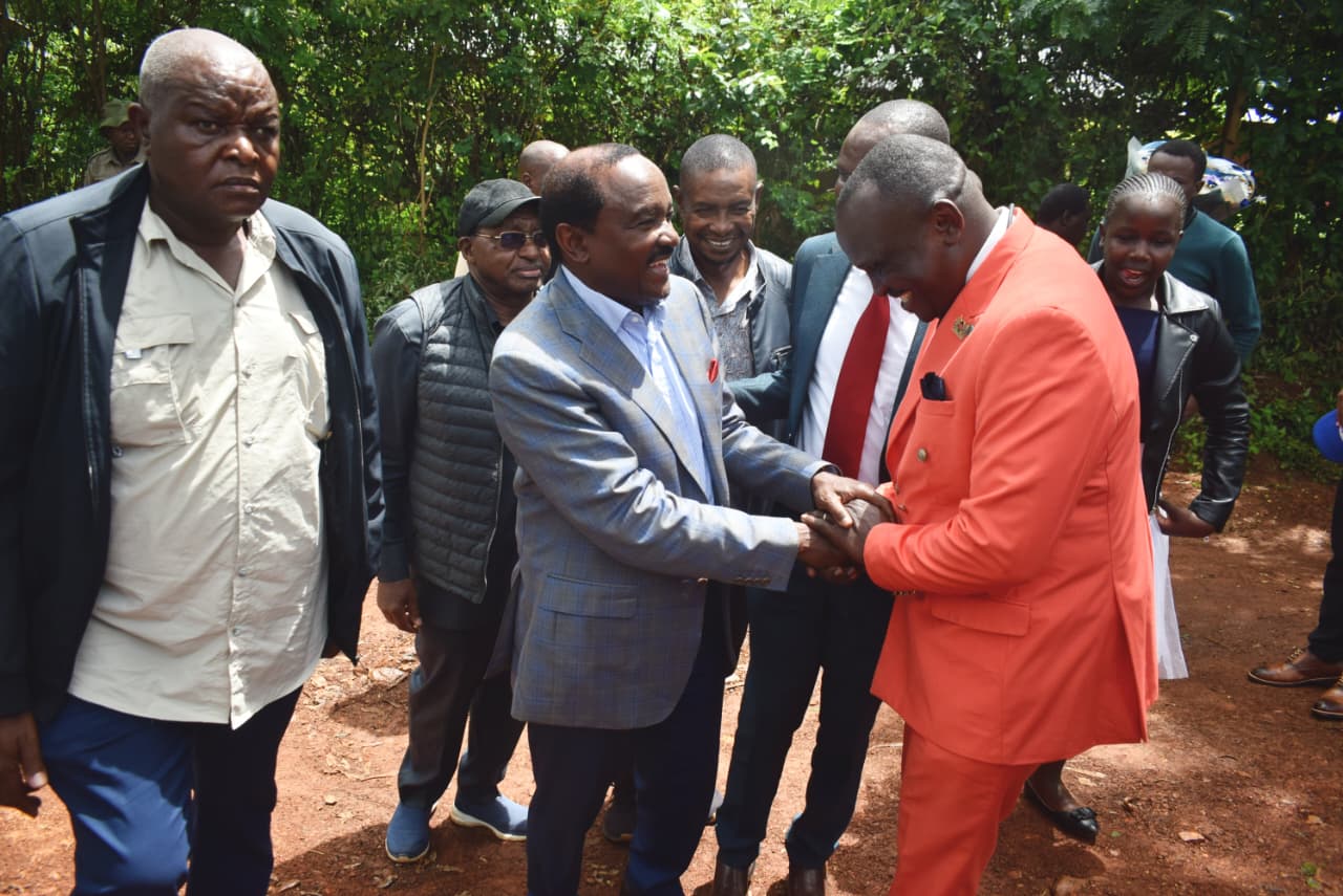 Wiper leader Kalonzo Musyoka geets Pastor George Odhiambo at Nyakongo SDA Church in Rangwe constituency/Robert Omollo