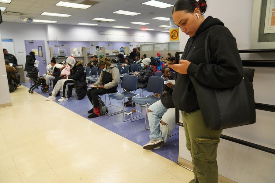 People wait at a job center of the New York City Department of Social Services in New York, the United States, on Nov. 7, 2025. (Xinhua/Zhang Fengguo)