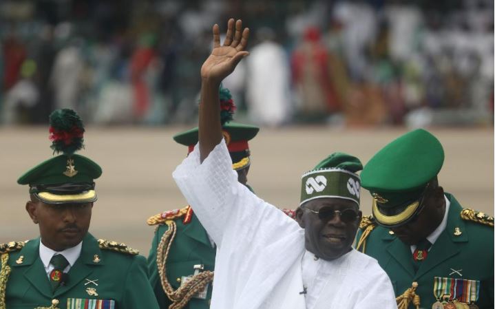 Bola Ahmed Tinubu (Front) waves to people after being sworn in as Nigeria's new president at a ceremony in Abuja, Nigeria, on May 29, 2023. (Photo by Sodiq/Xinhua)