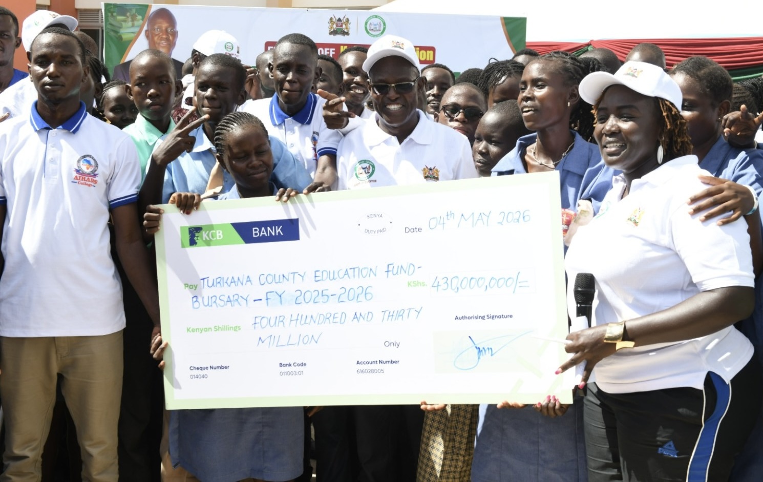 Governor for Turkana Jeremiah Lomurkai (c) during launch of disbursement of bursaries in Lodwar town