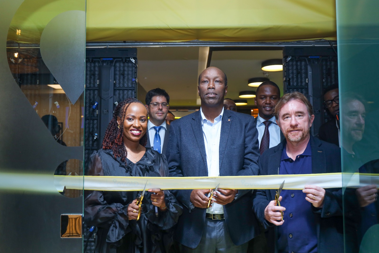 Glovo Kenya General Director Caroline Mutuku, CS Ministry of Investments, Trade and Industry Hon. Lee Kinyanjui and Glovo Co-Founder Sacha Michaud cut a ribbon to mark the official opening of the Glovo Kenya Office at the Piano in Nairobi today.