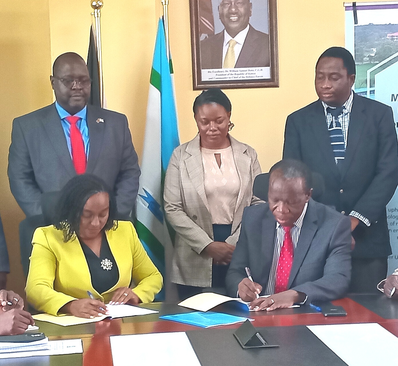 Masinde Muliro University of Science and Technology VC Prof Solomon Shibairo and acting National Biosafety Authority CEO Dr Anne Karemi signing a memorandum of agreement at University on Friday