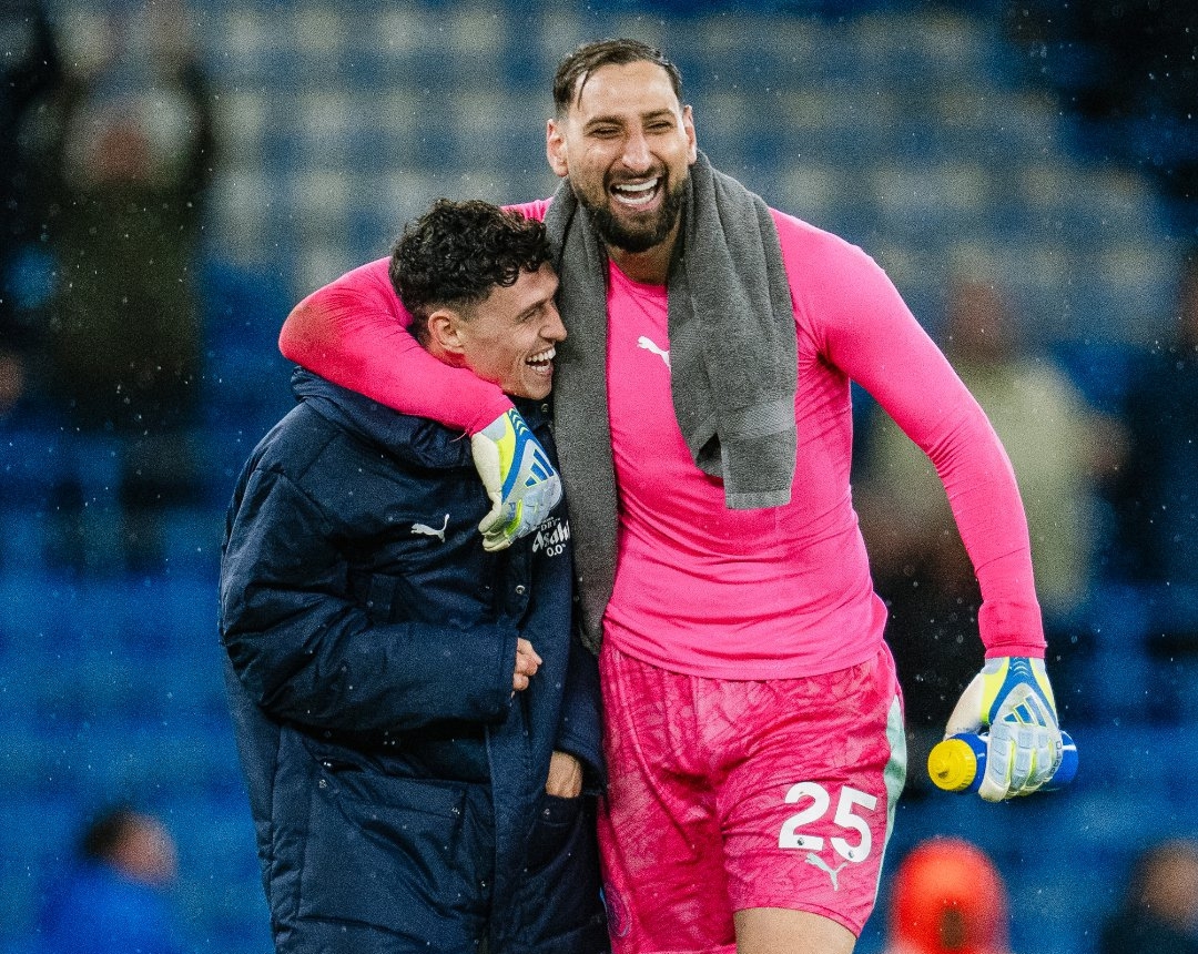 Manchester City's Phil Foden (L) and Gianluigi Donnarumma/ MANCHESTER CITY