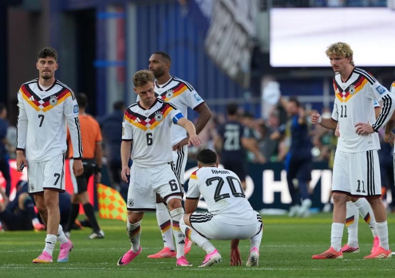 Germany players look dejected after their defeat on penalties against Paraguay. (Xinhua/Huang Zongzhi)