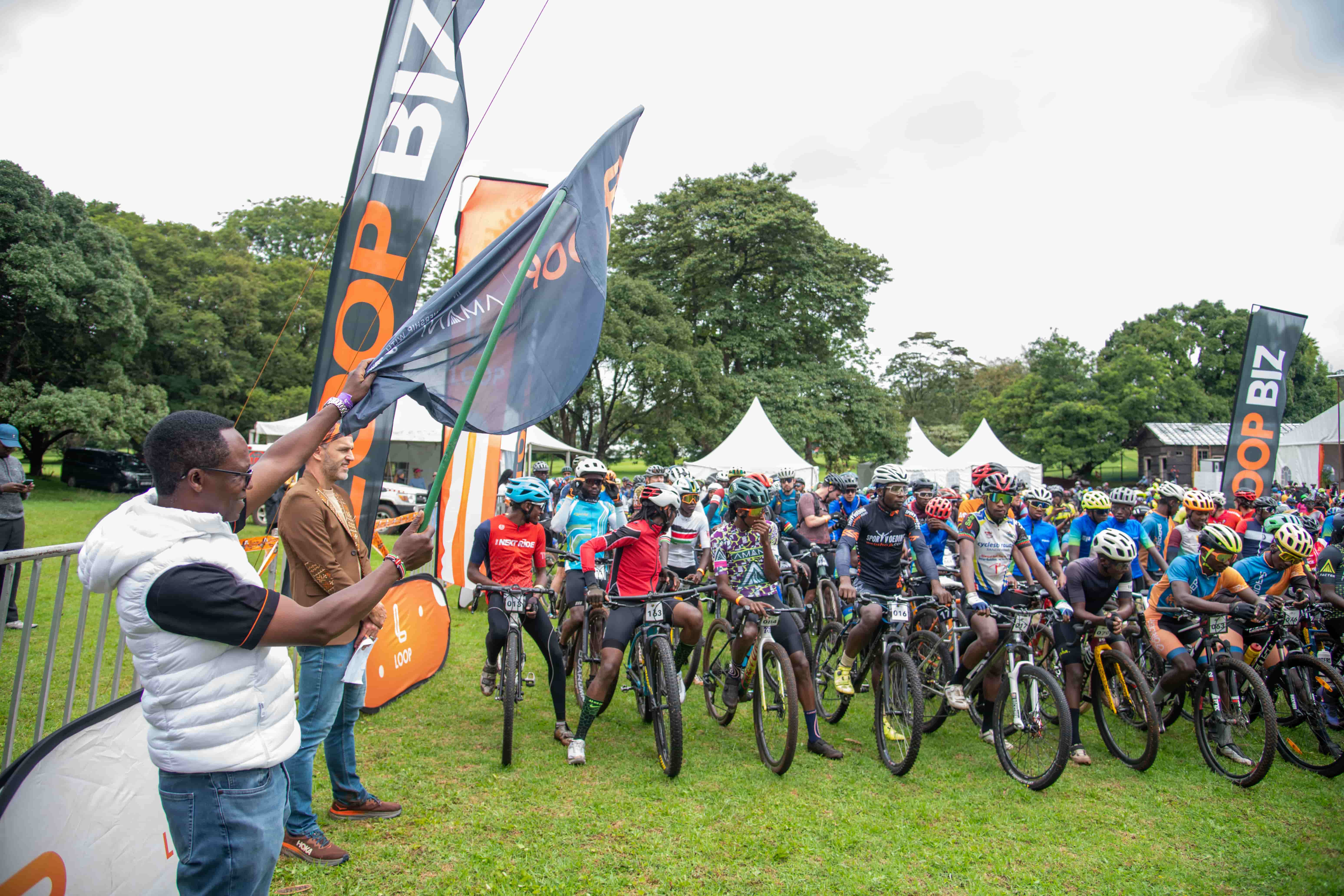 NCBA GMD John Gachora flags off cyclists during the opening leg of the 2026 LOOP Safari Gravel Series at Limuru Country Club