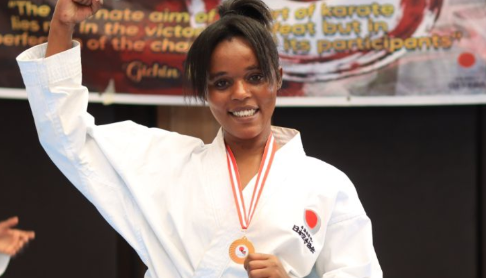 Georgina Kanini donning her black belt/HANDOUT