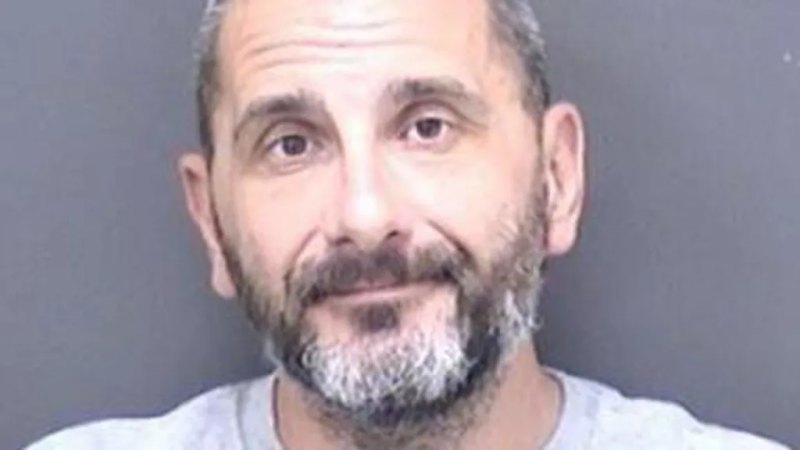 Man held after woman's body found in suitcase