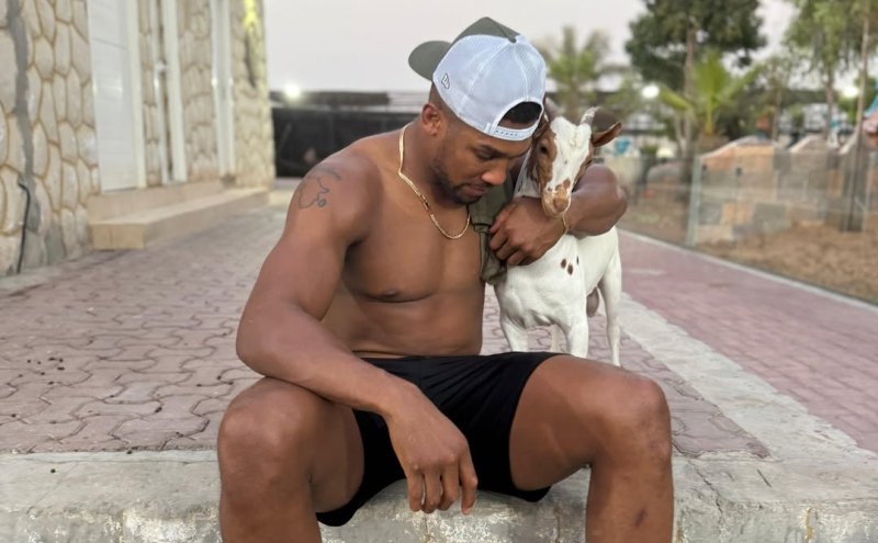 Anthony Joshua's Playful Goat Interaction Charms Female Fans