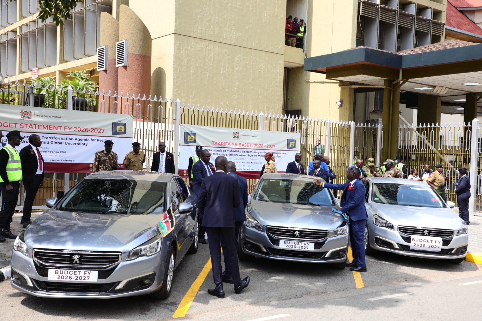 Briefcase, custom plate and banter mark Mbadi’s big day