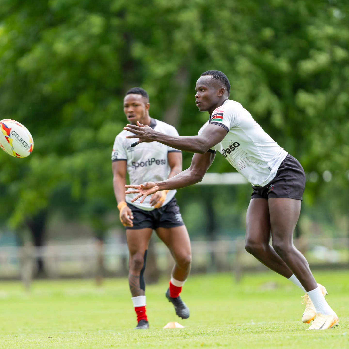Kenya sevens Victor Mola passes the ball during a training session