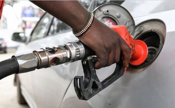 A man fuel a car at a petrol station