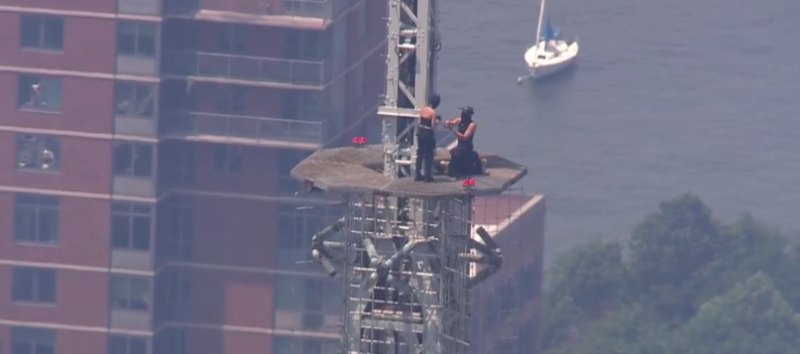 Daredevil pair apparently engaged atop Empire State