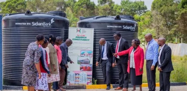 Sidian Bank donates water tank donations to schools