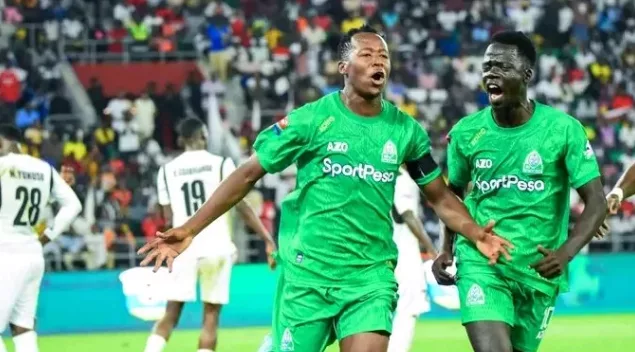Gor Mahia assistant captain Mike Kibwage celebrates alongside teammate Jackson Dwang during their opening match/HANDOUT
