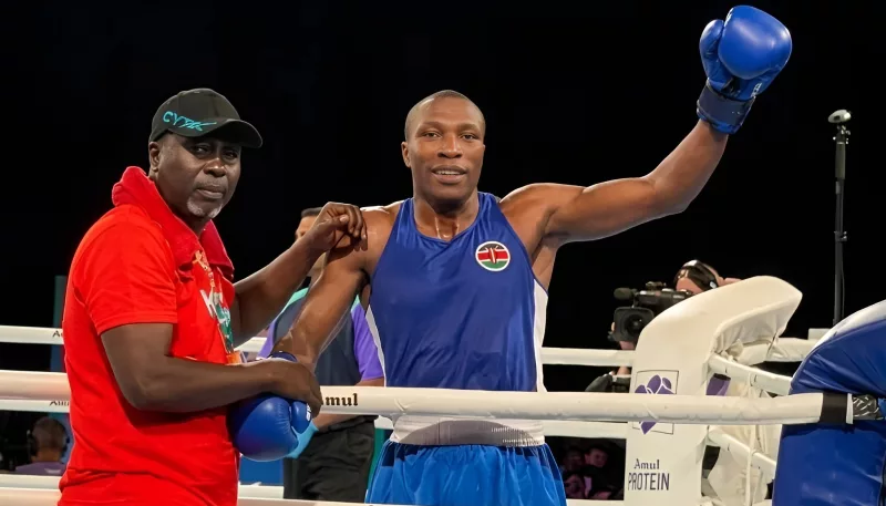 Hit Squad head coach Benjamin Musa congratulates Robert Okaka after winning