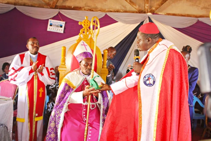 Apostle Dr. John Kisilu hand over the Jesus Miracle Family Church seal to Bishop Rev. Charles Mutua soon after his enthronement on Saturday.