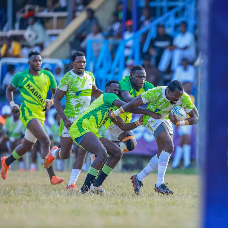 Kabras Eric Cantona and Fredrick Wangila tackle KCB's Mike Wekesa at the Kabeberi sevens