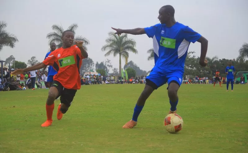Action between St Mary's School Yala (in red) and Menengai in the opening football game