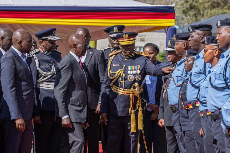 Inspector General of Police Douglas Kanja explains to President William Ruto the new features of the new-look uniform for general service officers during its unveiling at the Police Training College in Kiganjo, August 28, 2026. /PCS