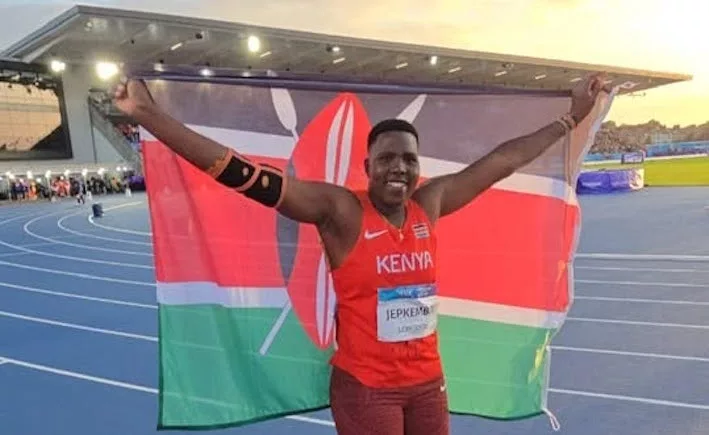 Commonwealth Games javelin bronze medallist Irene Jepkemboi celebrates with the Kenyan flag