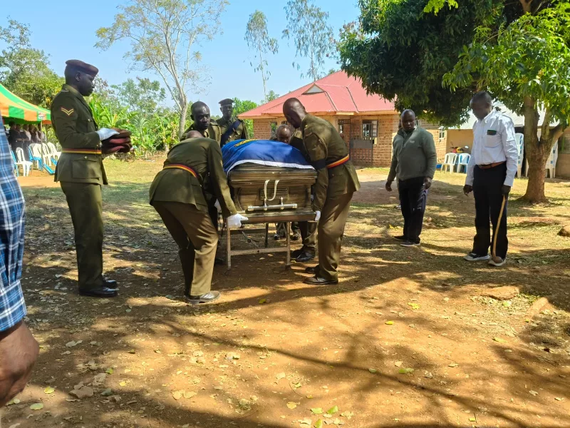 GSU officers move the casket carrying the remains of Henry Ojudi during his burial at Got Nyapong', Bondo.