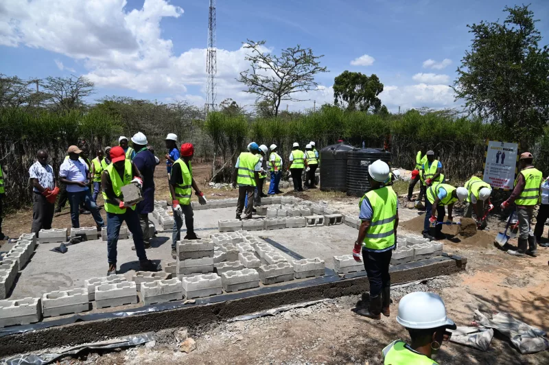 Members of the Muramati community and Habitat for Humanity Kenya help to build a house for a widow in Laikipia county on August 27, 2026/ ALICE WAITHERA