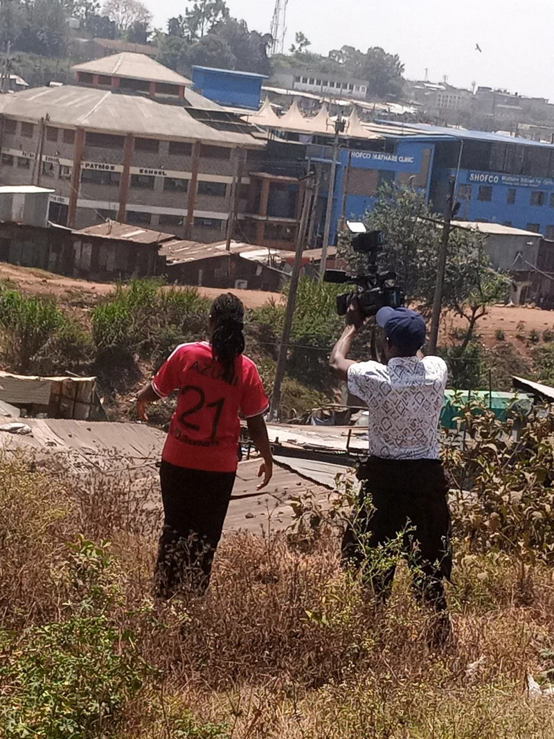 Damaris Emily with journalists in Mathare