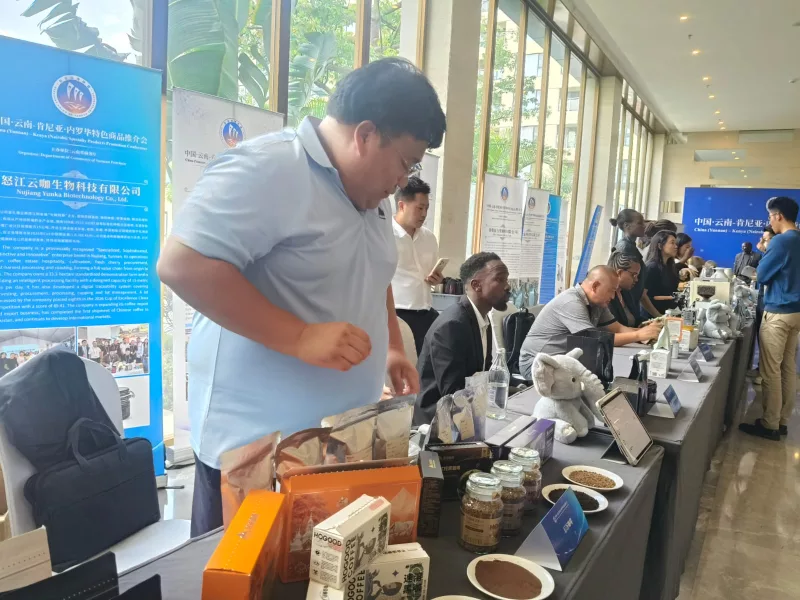 A coffee dealer from Yunnan displays his products at the Kenya-China specialty products promotion conference, Nairobi, Sept 2026.