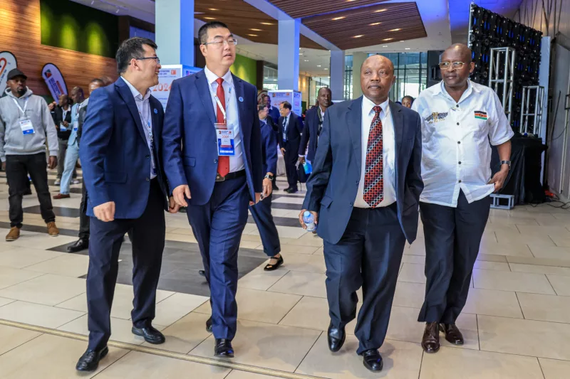 L-R : Afripeak Expo Kenya Managing Director Gao Wei [Red Tie] Director-Manufacturing Sector Investments,Invest Kenya  and KNCCI National Director Joseph Mutavi Kithu  during the official opening of the 9th Kenya International Industrial Expo and Kenya Investment &amp; Trade Fair 2026, which opened at the Sarit Expo Centre –Nairobi