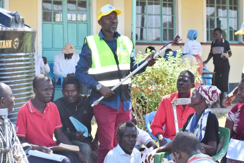 Director Widowers Health Empowerment and Support Services program Samuel Okombo speaks to disabled people in Karachuonyo constituency/Robert Omollo