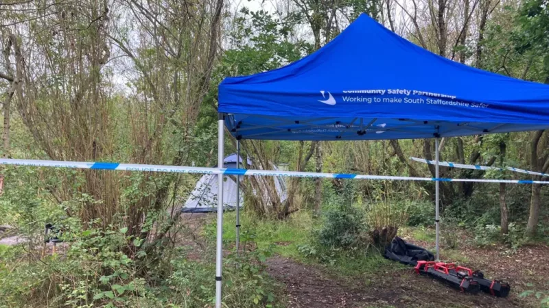 A cordon remains in place at a wooded area near Strawberry Lane in Cheslyn Hay