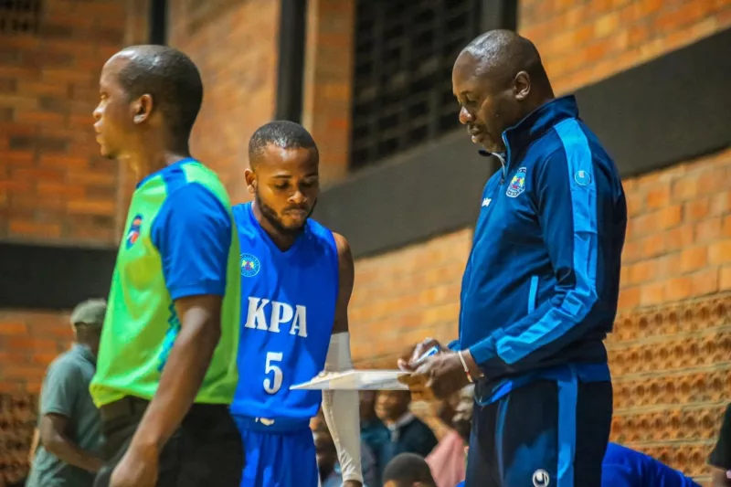 KPA's headcoach Robert Mugabe instructs his player OKall Koranga