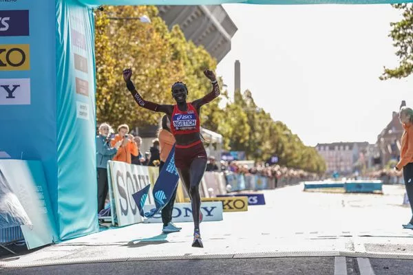 Agnes Ngetich crosses the finish line setting a women-only half marathon world record (1:05:15) at the World Athletics Road Running Championships.