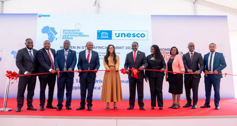 Education Cabinet Secretary Julius Ogamba, Principal Secretary for Higher Education and Research Beatrice Inyangala (right) and WITIA Founder and Chair Eunice Pohlmann (left) joined by other guests for a ribbon cutting at the Women in STEM Africa Summit 2026 on September 3, 2026./HANDOUT