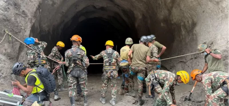 Army personnel have resorted to using explosives to blast into the hillside to reach the trapped workers