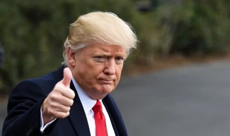 U.S. President Donald Trump gestures to media before boarding Marine One departing for Andrews Air Force Base en route to West Palm Beach, Florida, at White House in Washington D.C.,the United States, Feb. 3, 2017. (Xinhua/Yin Bogu)