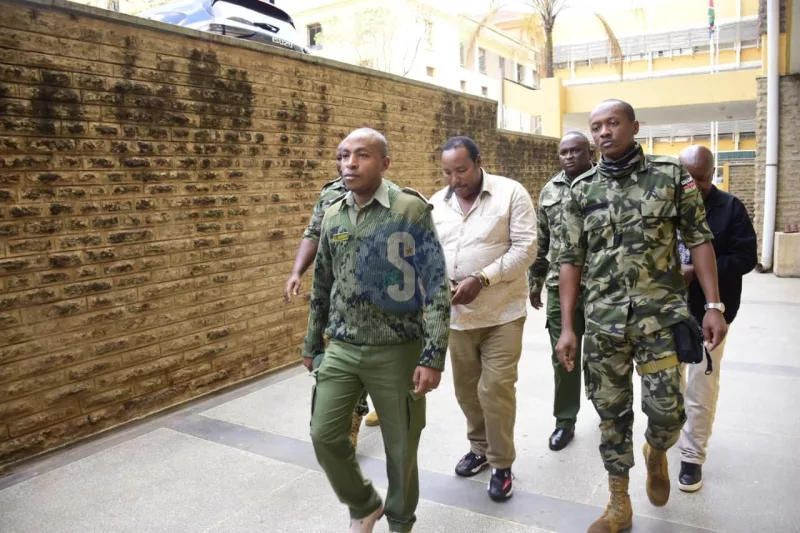 Former Kiambu Governor Ferdinand Waititu escorted by security officials to court